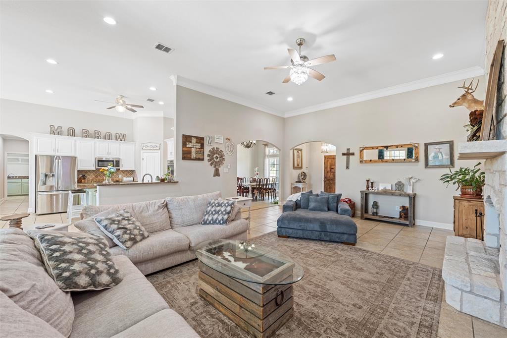 201 Camino Del Rancho Lorena, TX 76655 - Photo 6 of 35 a living room with furniture and a chandelier