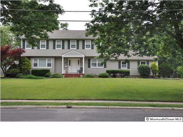 27 Cambridge Road Freehold, NJ 07728 - Photo 1 of 3 a house view with a garden