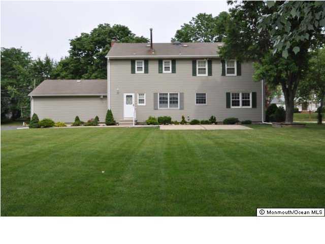 27 Cambridge Road Freehold, NJ 07728 - Photo 2 of 3 a black and white photo of a house