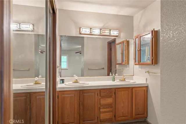 a view of a livingroom with a ceiling fan and window