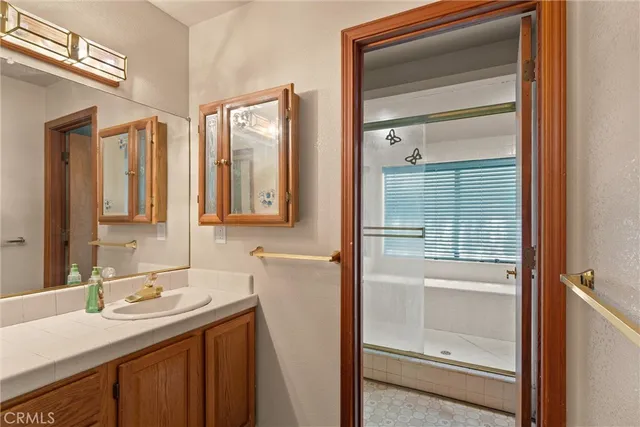 an empty room with a ceiling fan and a window