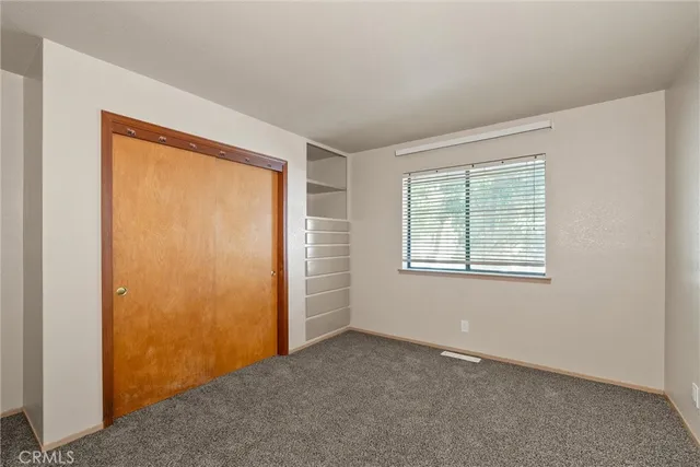 a view of an empty room with windows