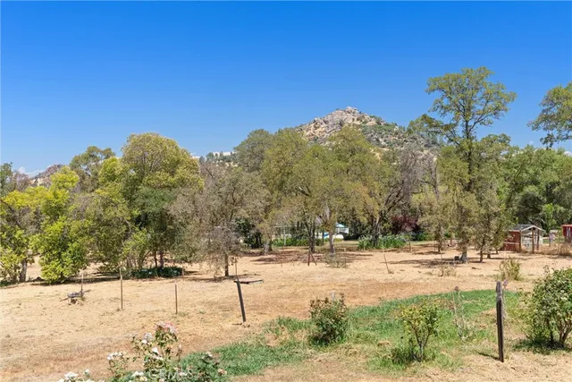 a view of an empty room with a window and closet