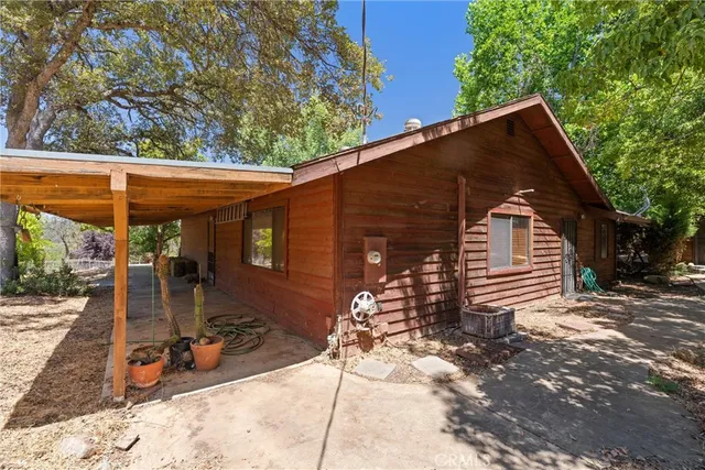 a view of a street with a tree