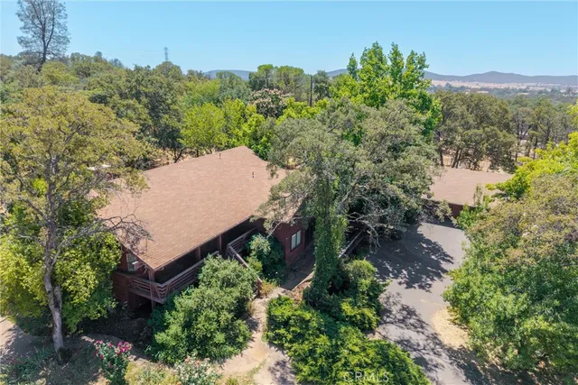 a view of empty room with fireplace and fan