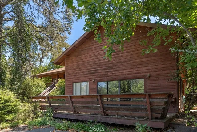 a kitchen with granite countertop stainless steel appliances a sink cabinets and a window