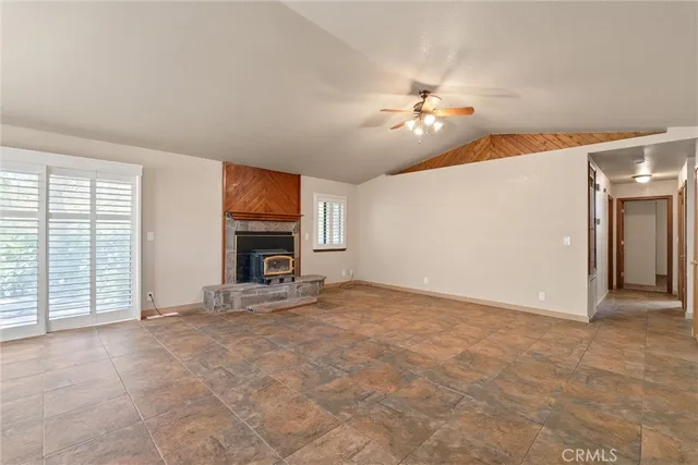 a kitchen with stainless steel appliances kitchen island a refrigerator sink and cabinets