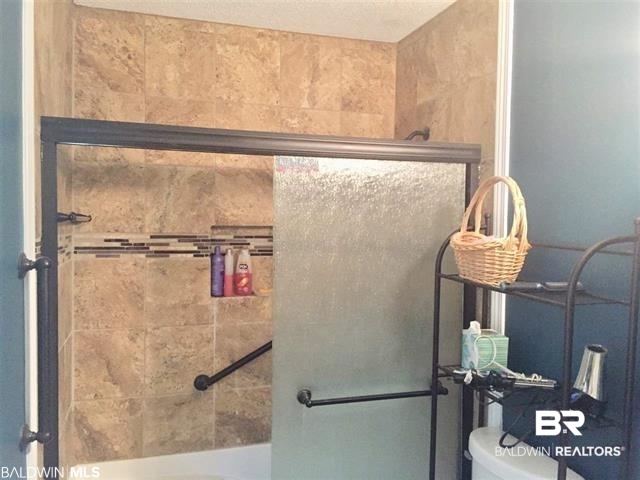 5925 Dixie Lane Mobile, AL 36693 - Photo 10 of 19 Bathroom with a shower with shower door and toilet