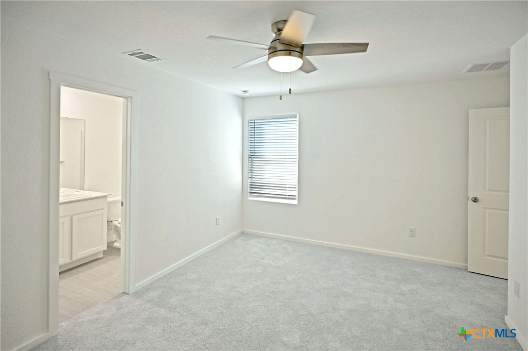 11806 Bluebell Ridge Converse, TX 78109 - Photo 13 of 20 wooden floor in an empty room with a window