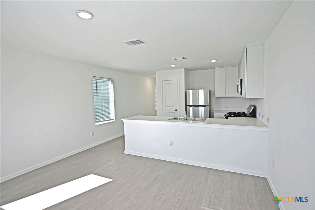 11806 Bluebell Ridge Converse, TX 78109 - Photo 6 of 20 a view of kitchen with wooden floor