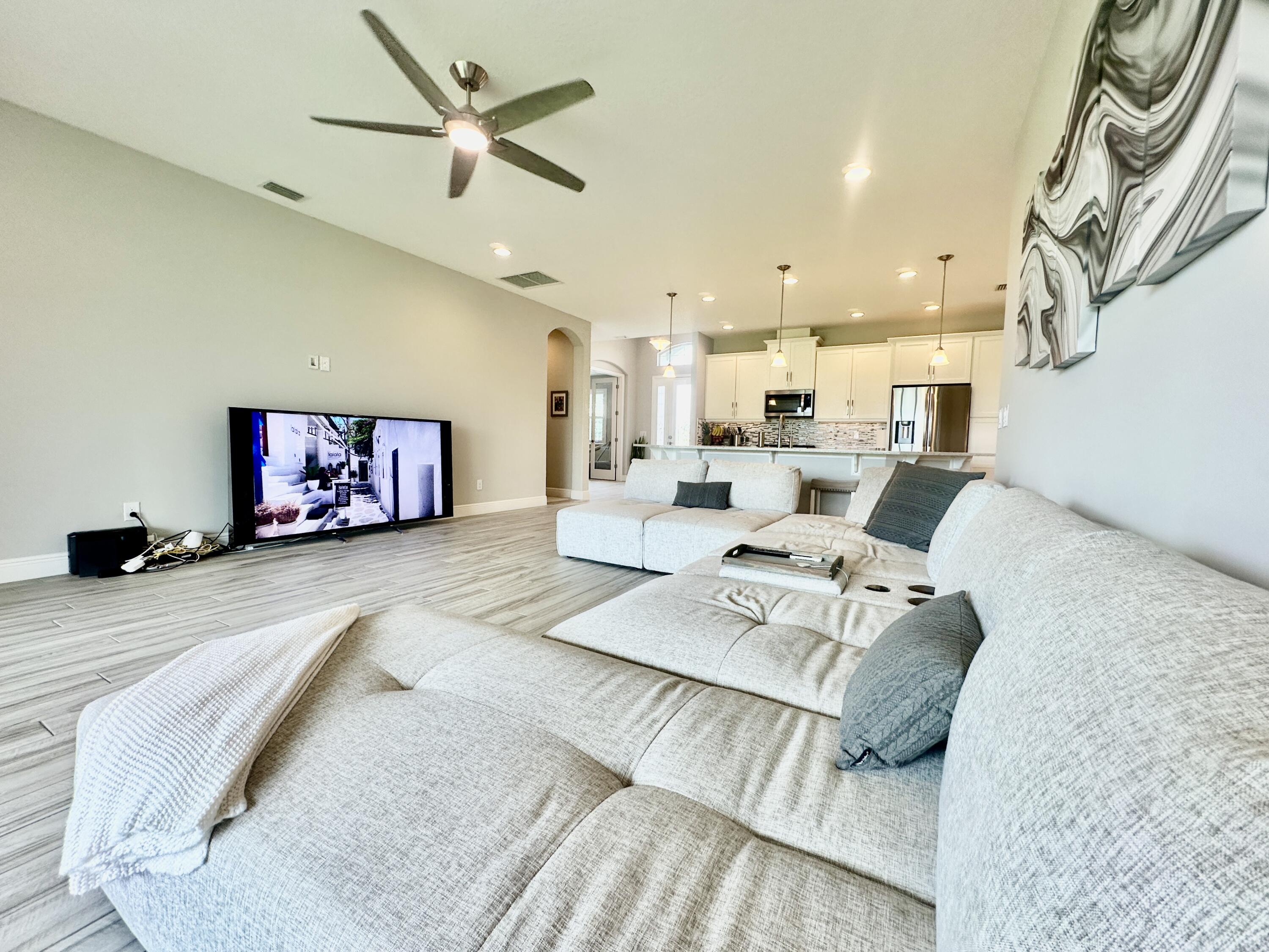 3044 Trasona Drive Melbourne, FL 32940 - Photo 14 of 36 a living room with furniture and a flat screen tv