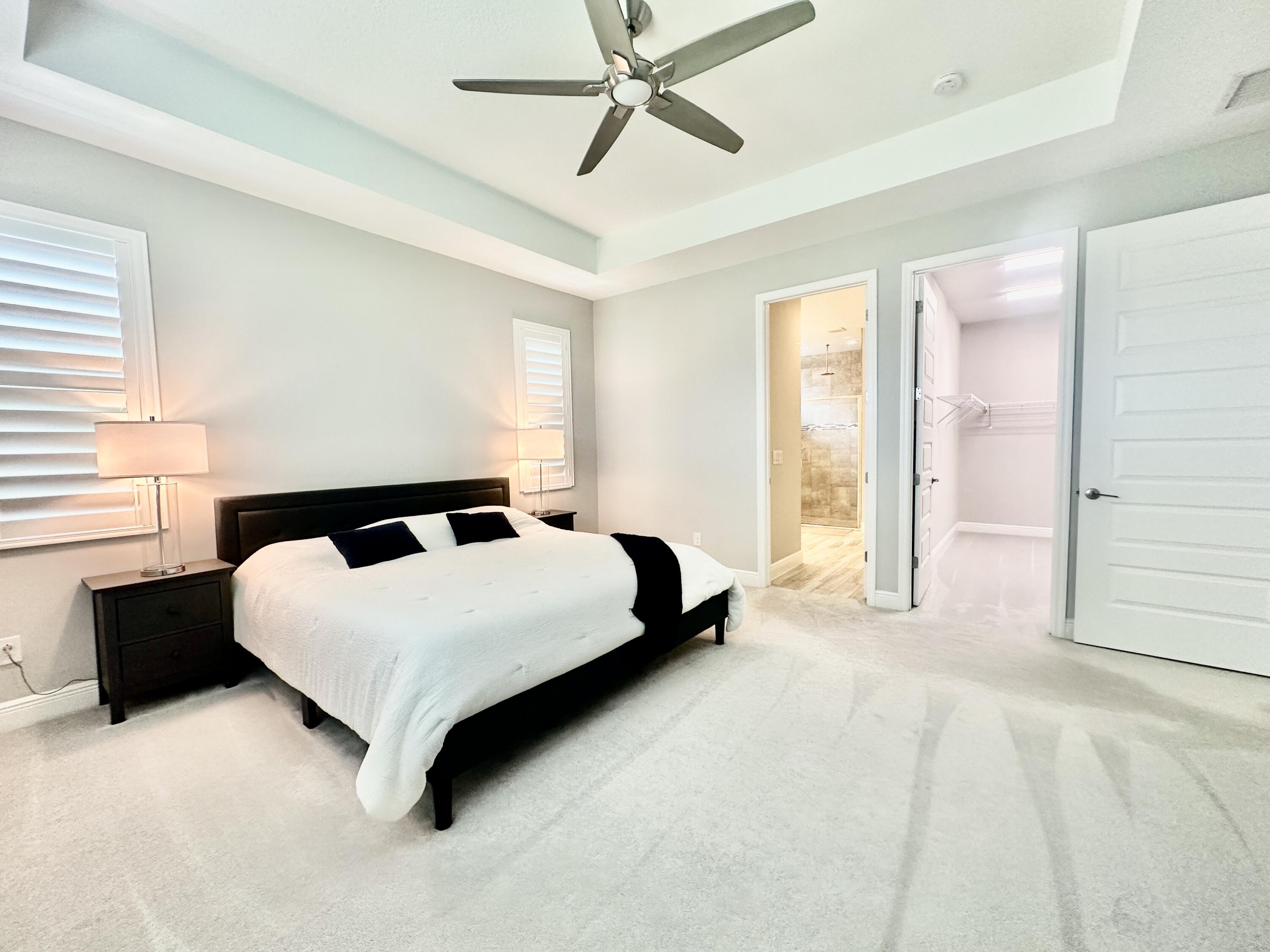 3044 Trasona Drive Melbourne, FL 32940 - Photo 16 of 36 a spacious bedroom with a bed and window