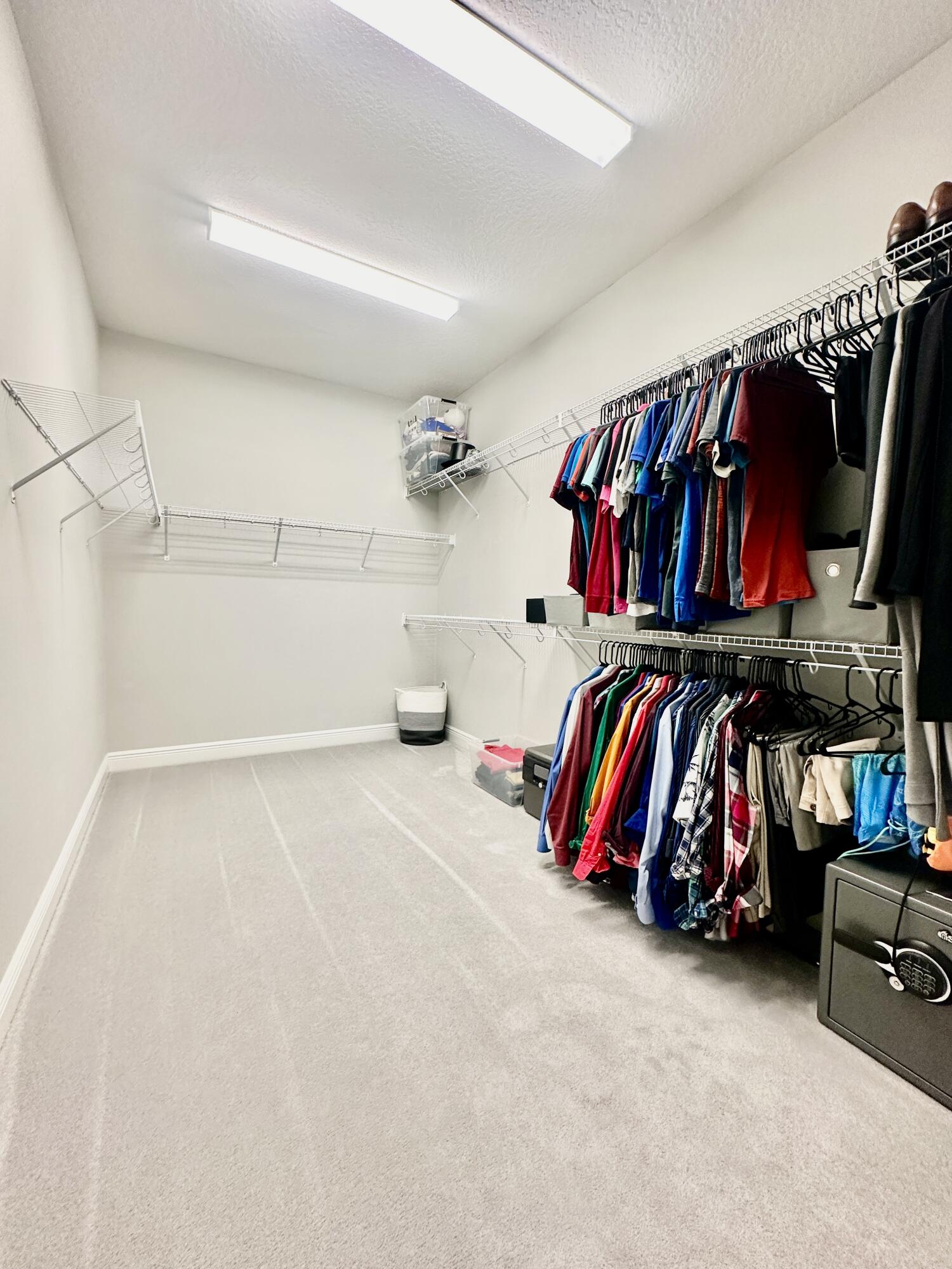 3044 Trasona Drive Melbourne, FL 32940 - Photo 17 of 36 a view of walk in closet with clothes and shoes