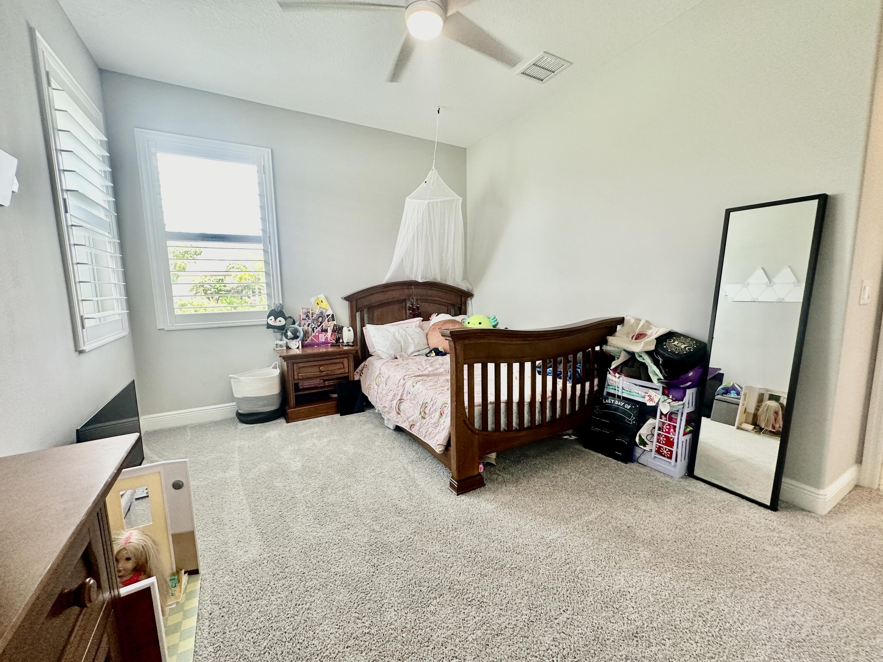 3044 Trasona Drive Melbourne, FL 32940 - Photo 19 of 36 a living room with furniture and a flat screen tv