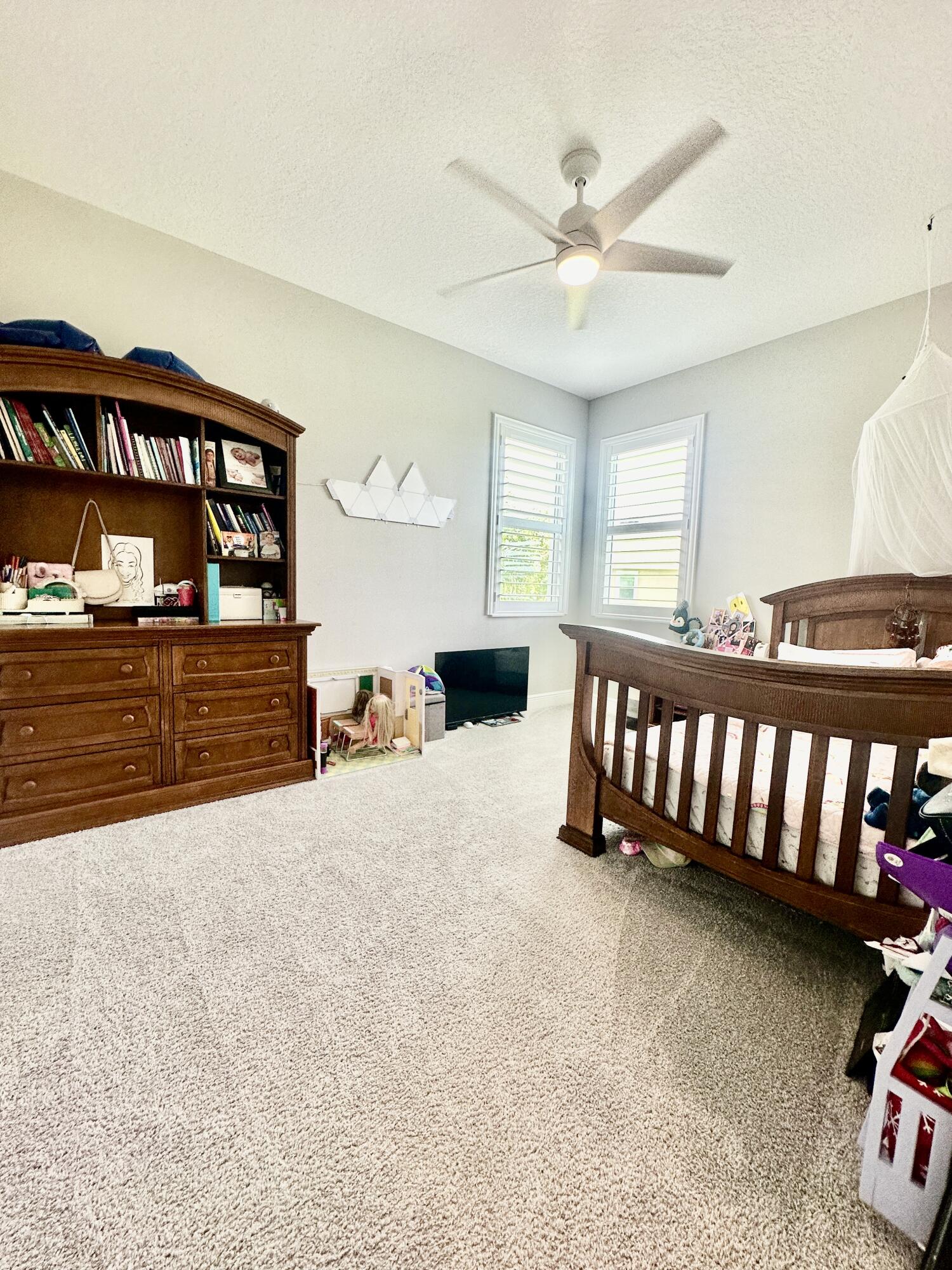 3044 Trasona Drive Melbourne, FL 32940 - Photo 20 of 36 a bed room with furniture and a window