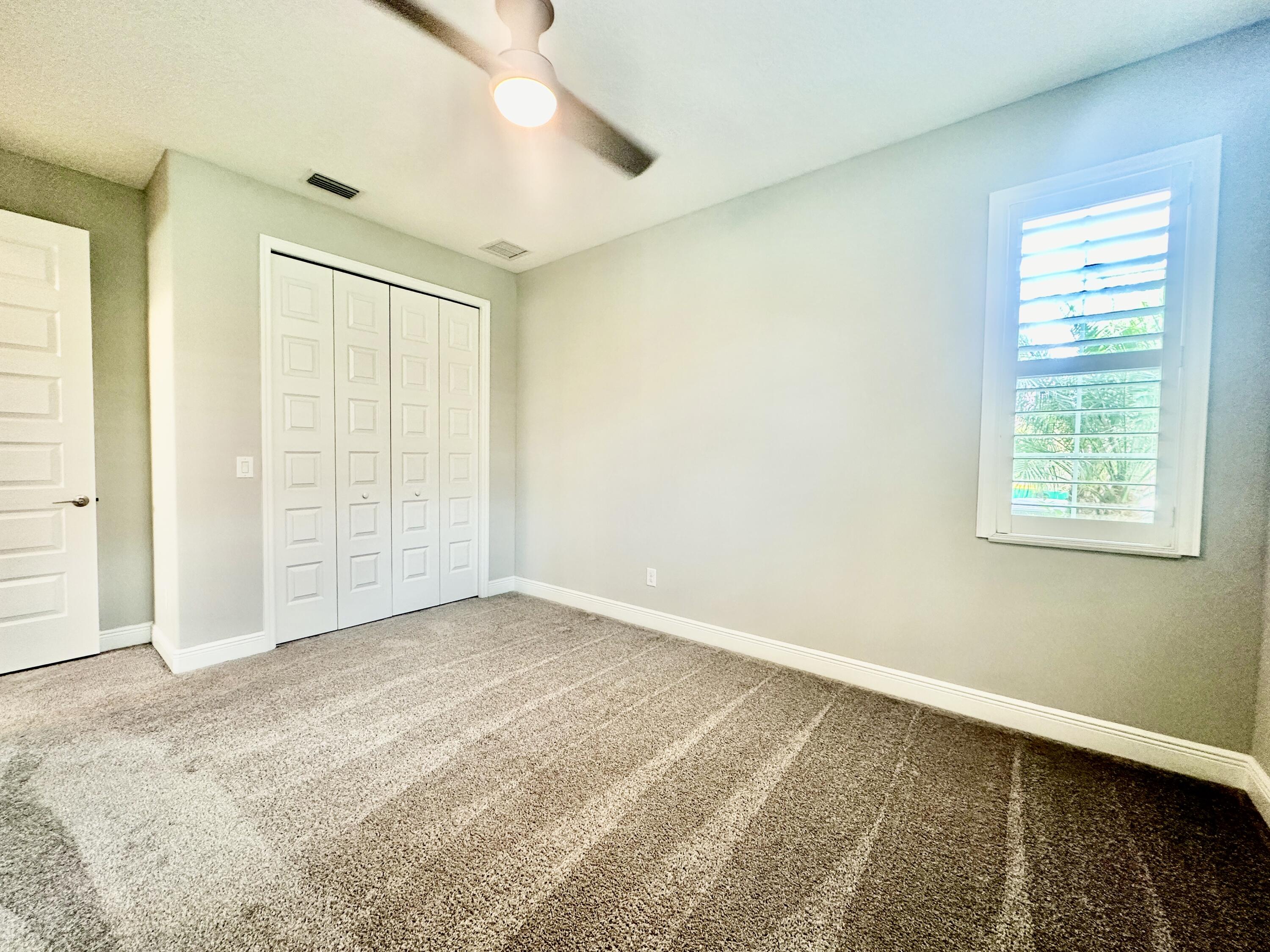 3044 Trasona Drive Melbourne, FL 32940 - Photo 22 of 36 an empty room with windows