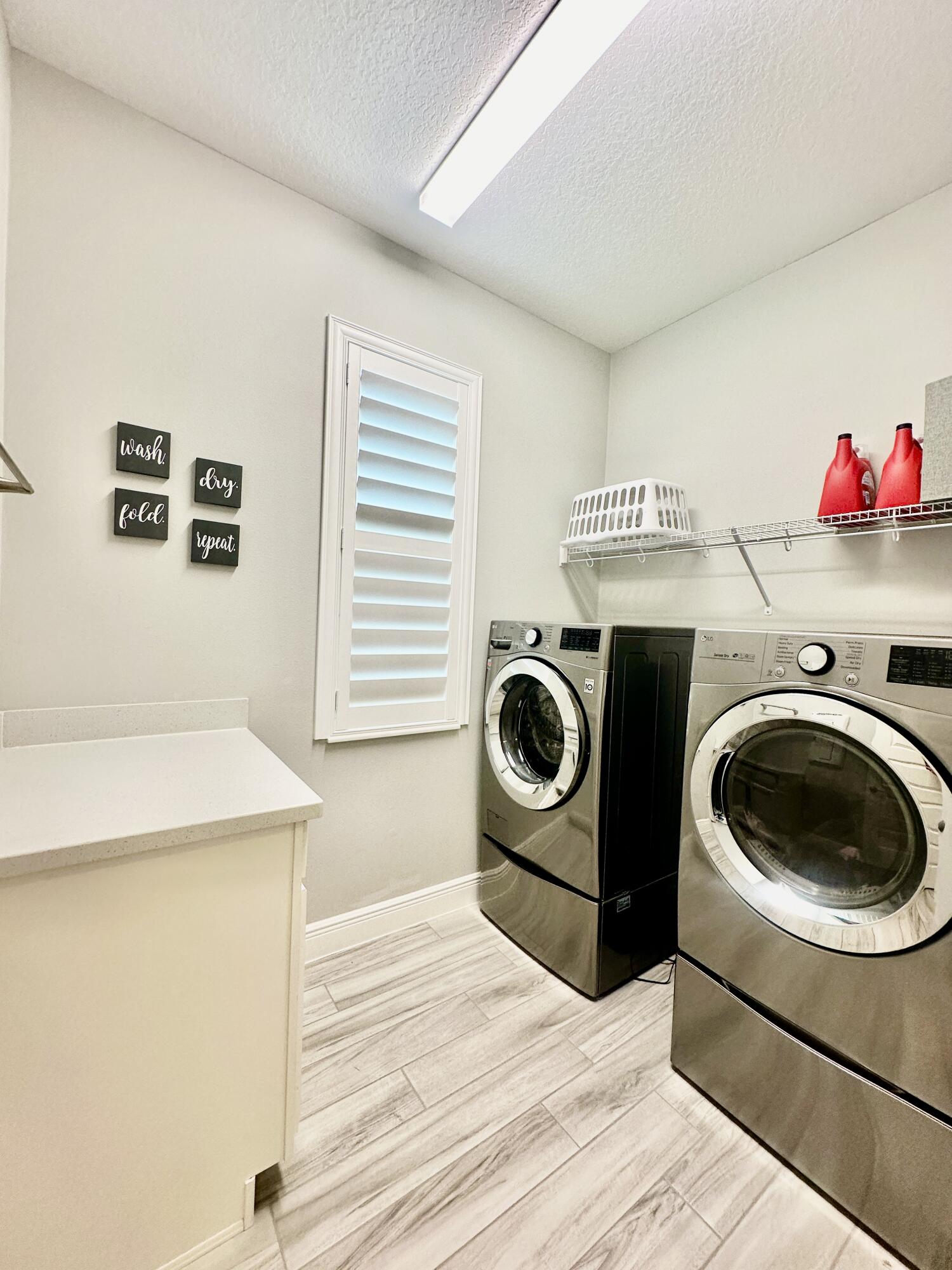 3044 Trasona Drive Melbourne, FL 32940 - Photo 28 of 36 a utility room with dryer and washer