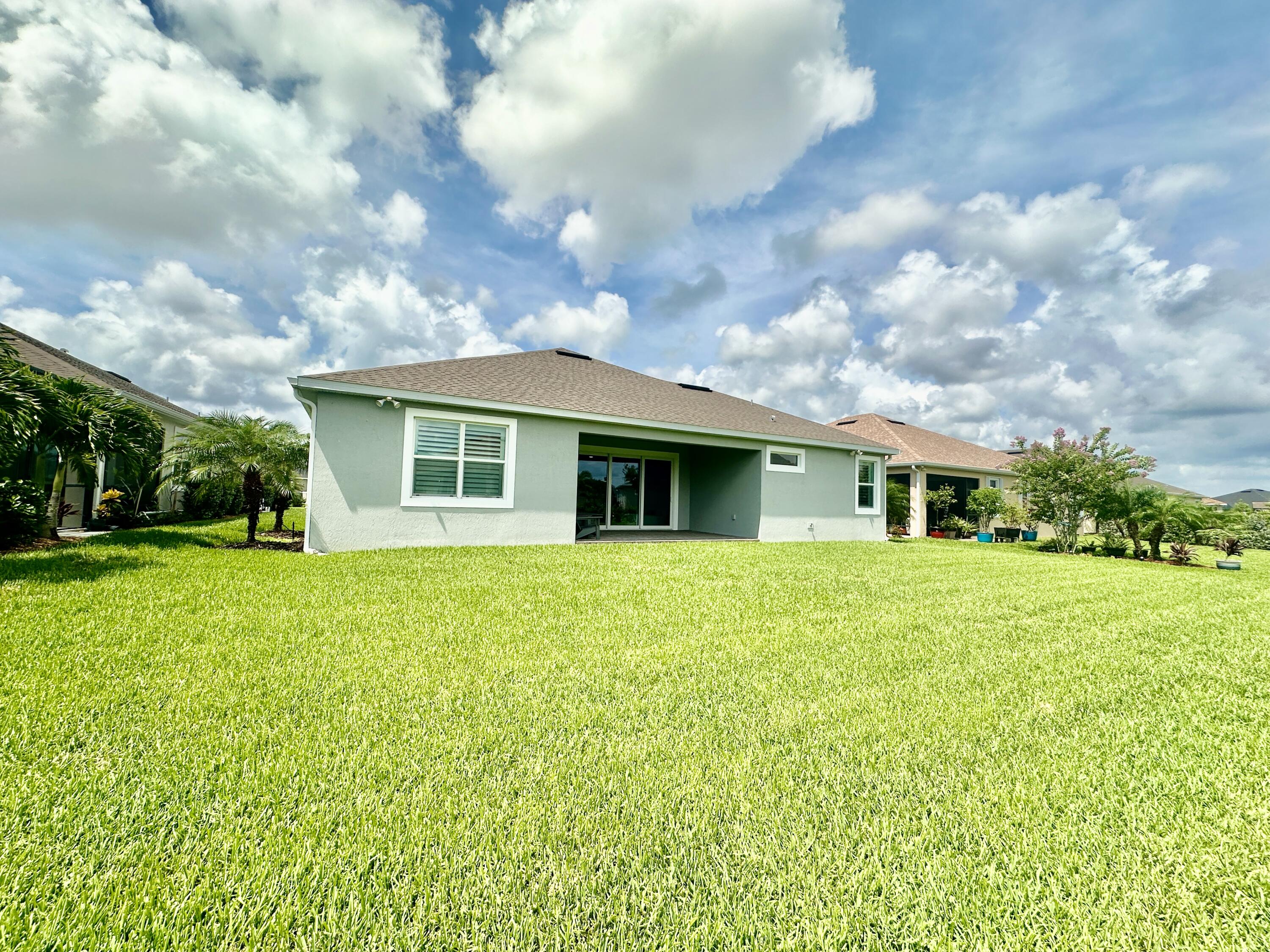 3044 Trasona Drive Melbourne, FL 32940 - Photo 30 of 36 a front view of house with yard and green space