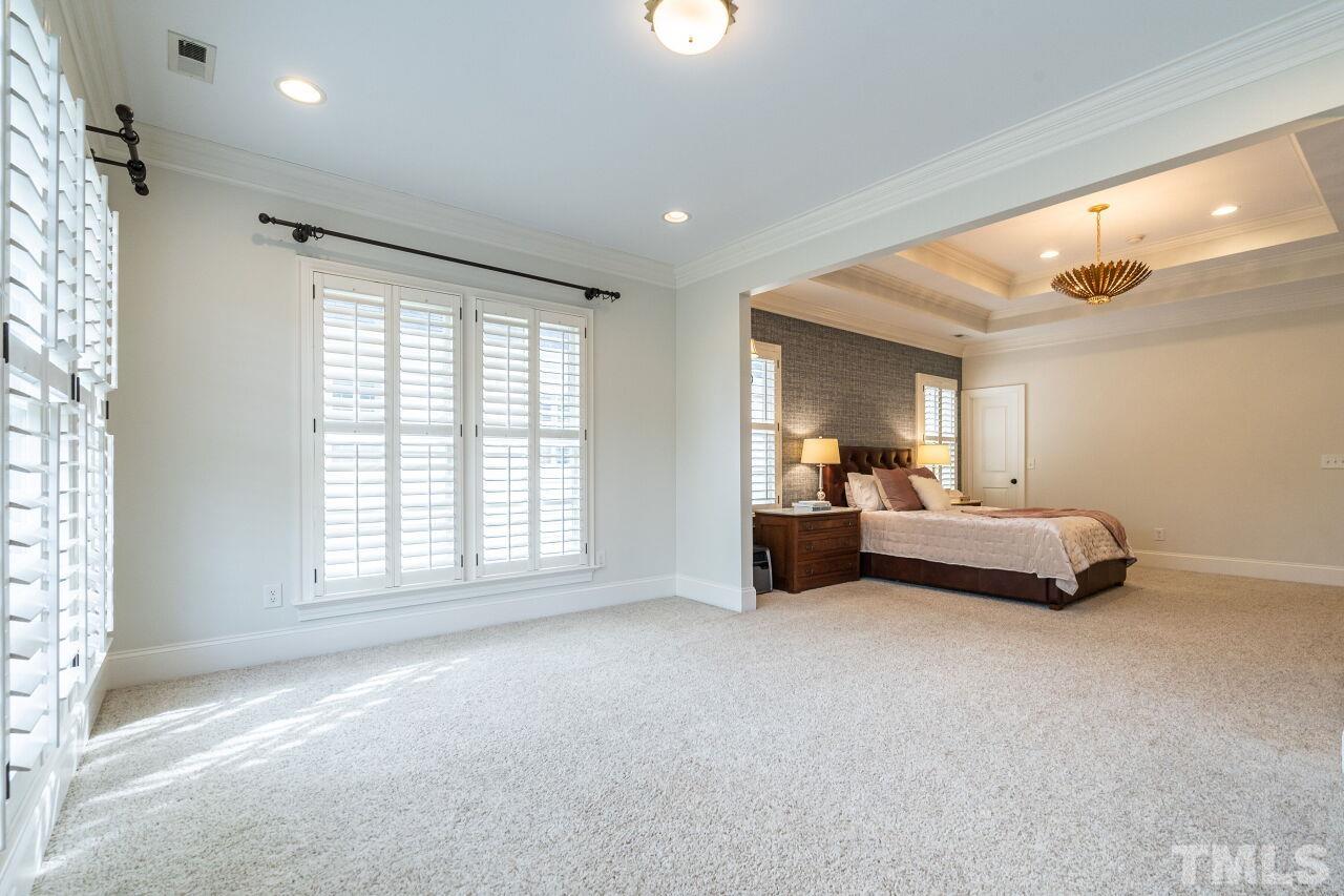 3056 Lewis Farm Road Raleigh, NC 27607 - Photo 23 of 43 a bed room with furniture and a large window