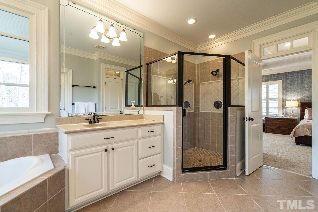 3056 Lewis Farm Road Raleigh, NC 27607 - Photo 27 of 43 a bathroom with a double vanity sink mirror and double