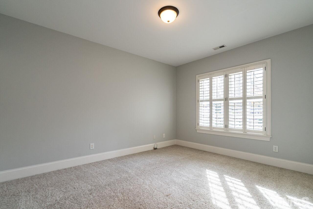 3056 Lewis Farm Road Raleigh, NC 27607 - Photo 30 of 43 an empty room with a window