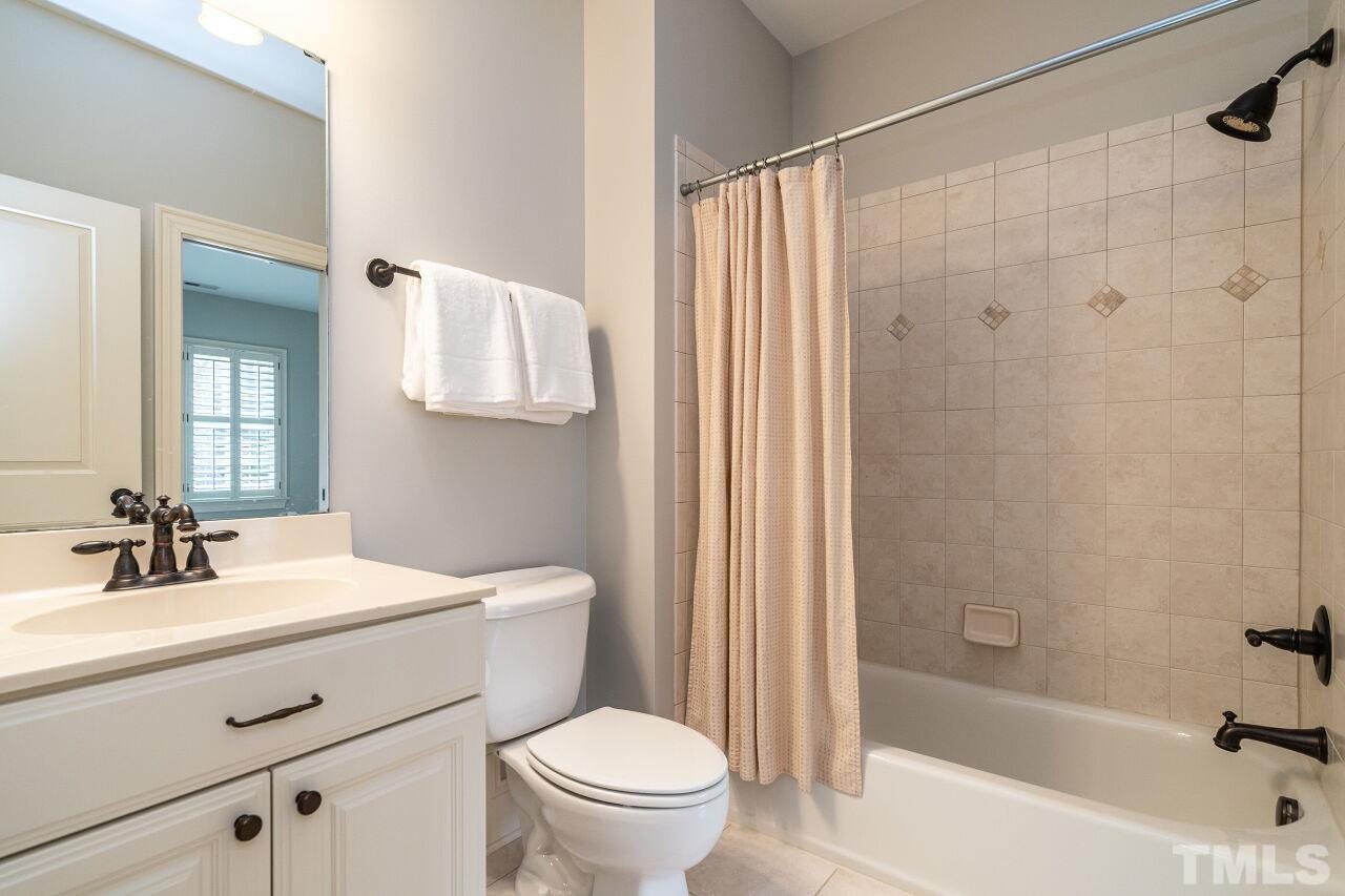 3056 Lewis Farm Road Raleigh, NC 27607 - Photo 31 of 43 a bathroom with a sink toilet and shower