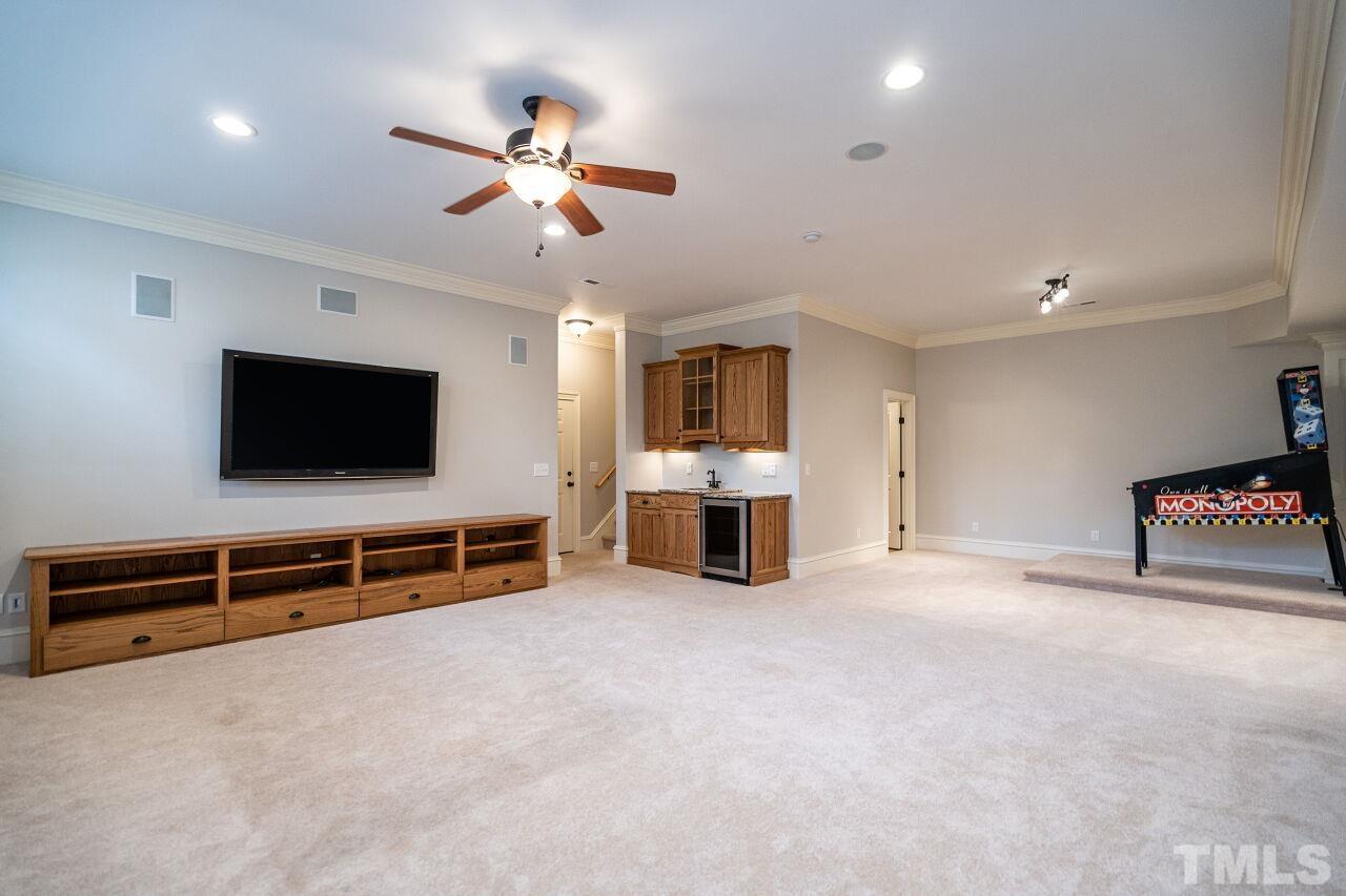 3056 Lewis Farm Road Raleigh, NC 27607 - Photo 36 of 43 a view of a livingroom with furniture and a flat screen tv