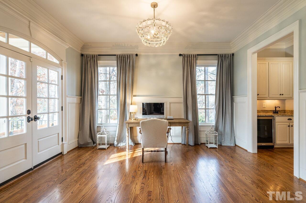3056 Lewis Farm Road Raleigh, NC 27607 - Photo 6 of 43 a view of a dining room with furniture window and wooden floor