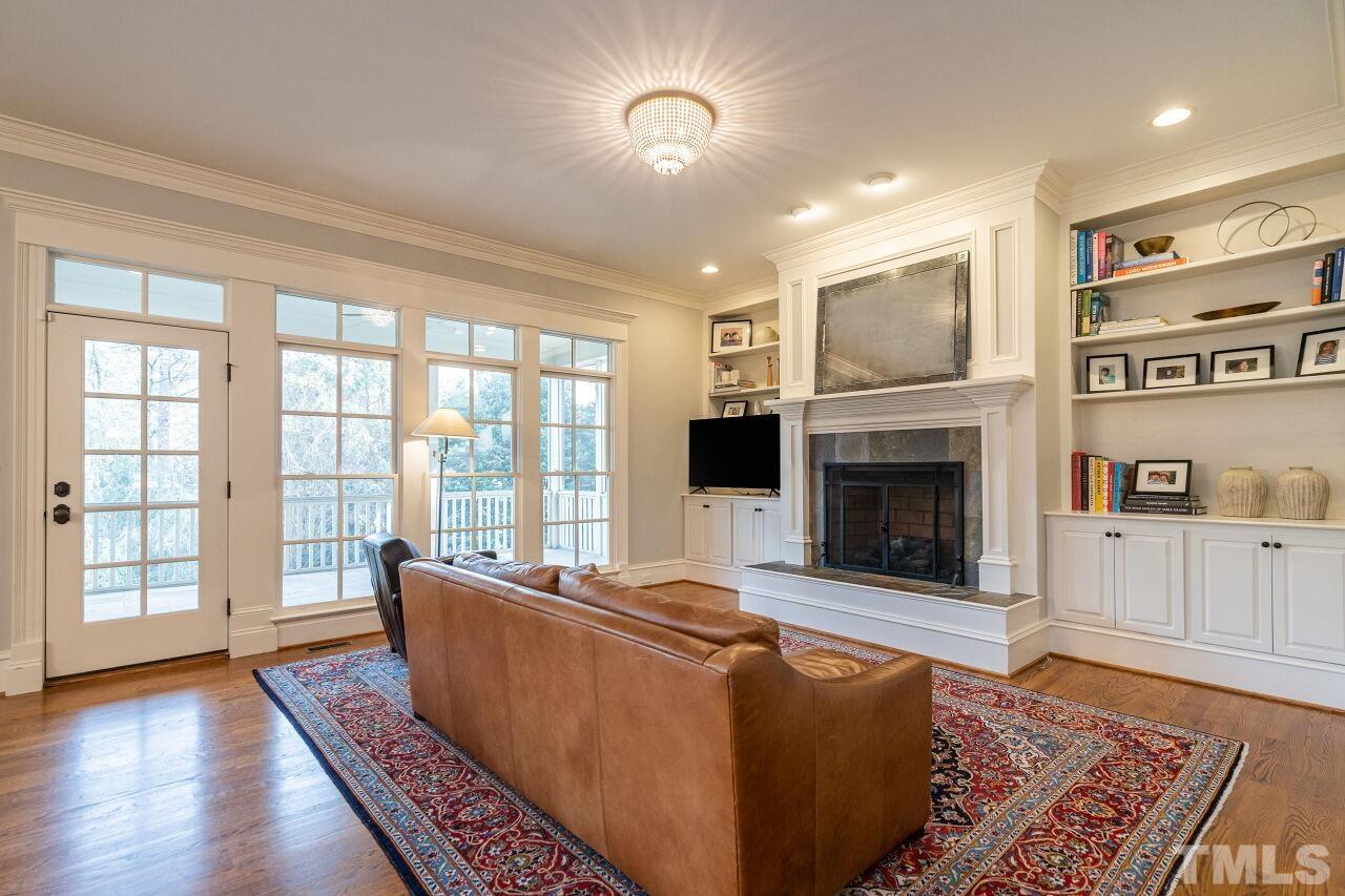 3056 Lewis Farm Road Raleigh, NC 27607 - Photo 9 of 43 a living room with furniture and a fireplace