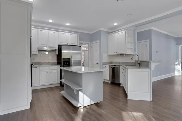 a bathroom with a sink a mirror and a toilet