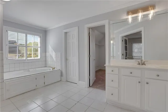 a bathroom with a toilet a sink a mirror a bathtub and shower