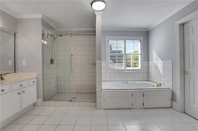 a view of a livingroom with a fireplace a ceiling fan and a fireplace