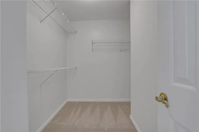 a kitchen with cabinets stainless steel appliances and a sink