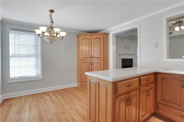 a view of a patio with table and chairs and potted plants