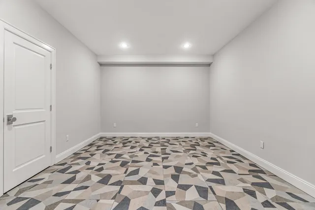 a view of a big room with wooden cabinet and a rug