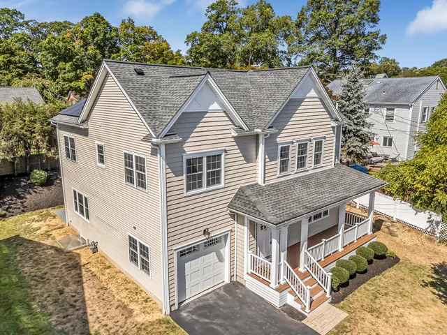 a aerial view of a house with a yard