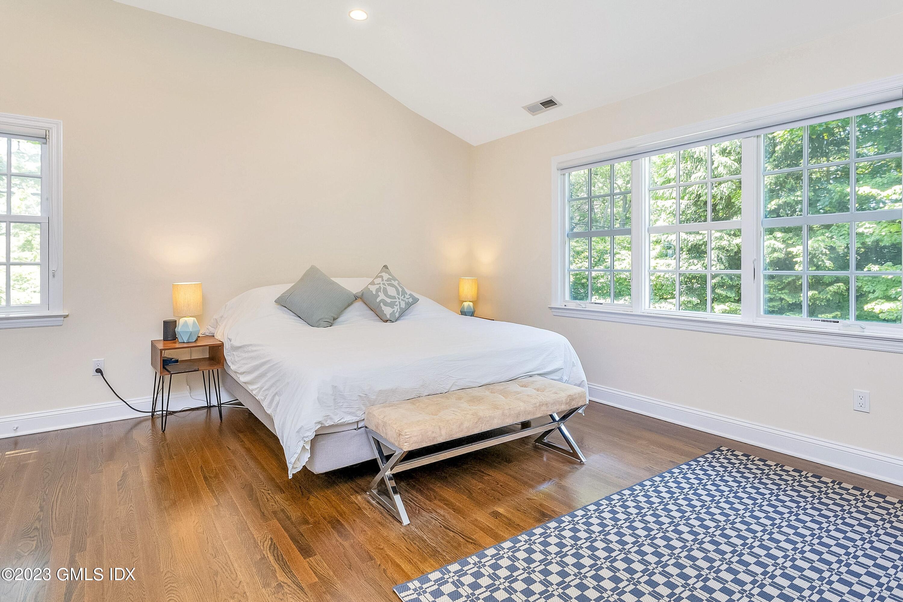 4 Bramble Lane Riverside, CT 06878 - Photo 11 of 19 a bedroom with a bed and wooden floor