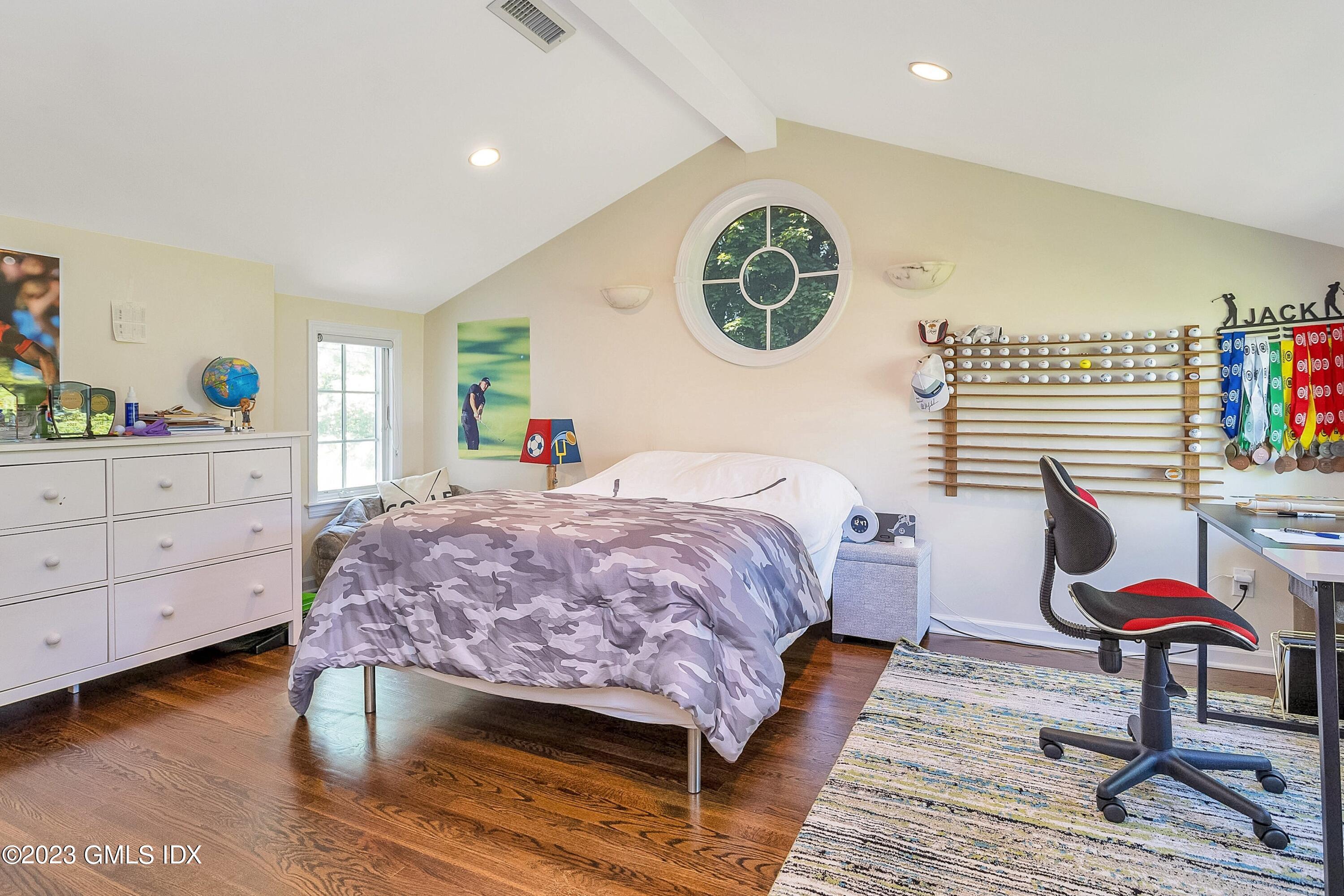 4 Bramble Lane Riverside, CT 06878 - Photo 13 of 19 a bedroom with a bed a dresser and chair