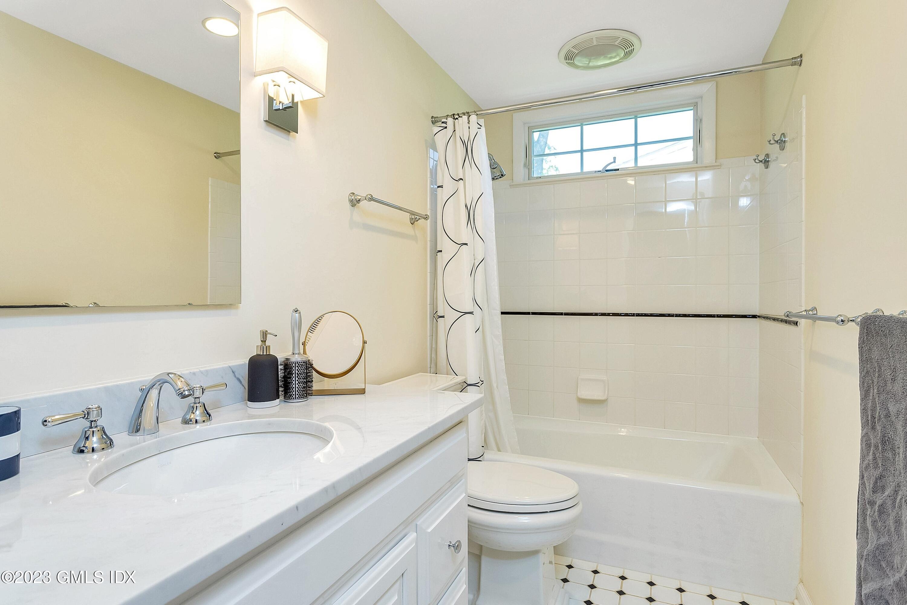4 Bramble Lane Riverside, CT 06878 - Photo 14 of 19 a bathroom with a granite countertop sink toilet and shower