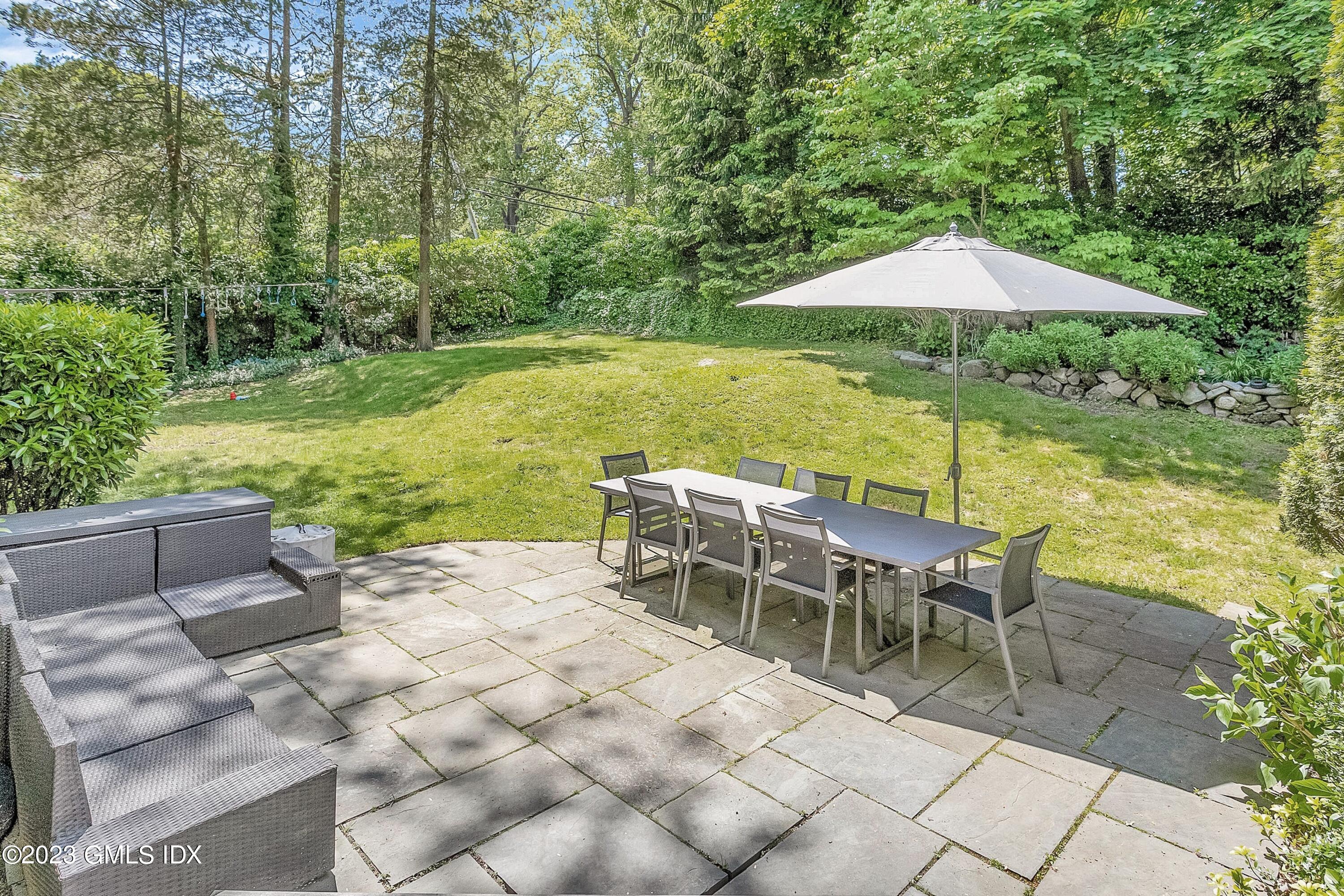 4 Bramble Lane Riverside, CT 06878 - Photo 3 of 19 an outdoor space with furniture and umbrella