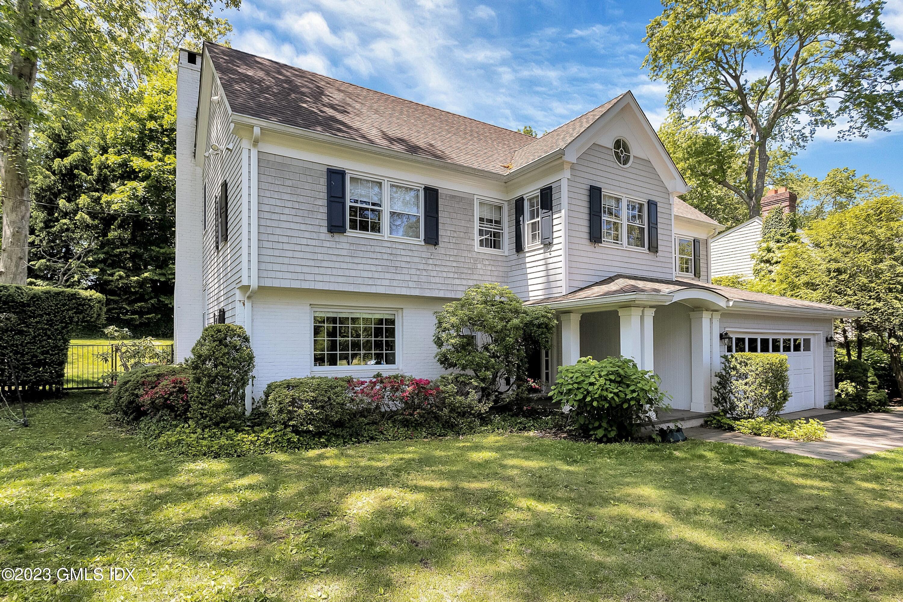 4 Bramble Lane Riverside, CT 06878 - Photo 5 of 19 a front view of house with yard and green space