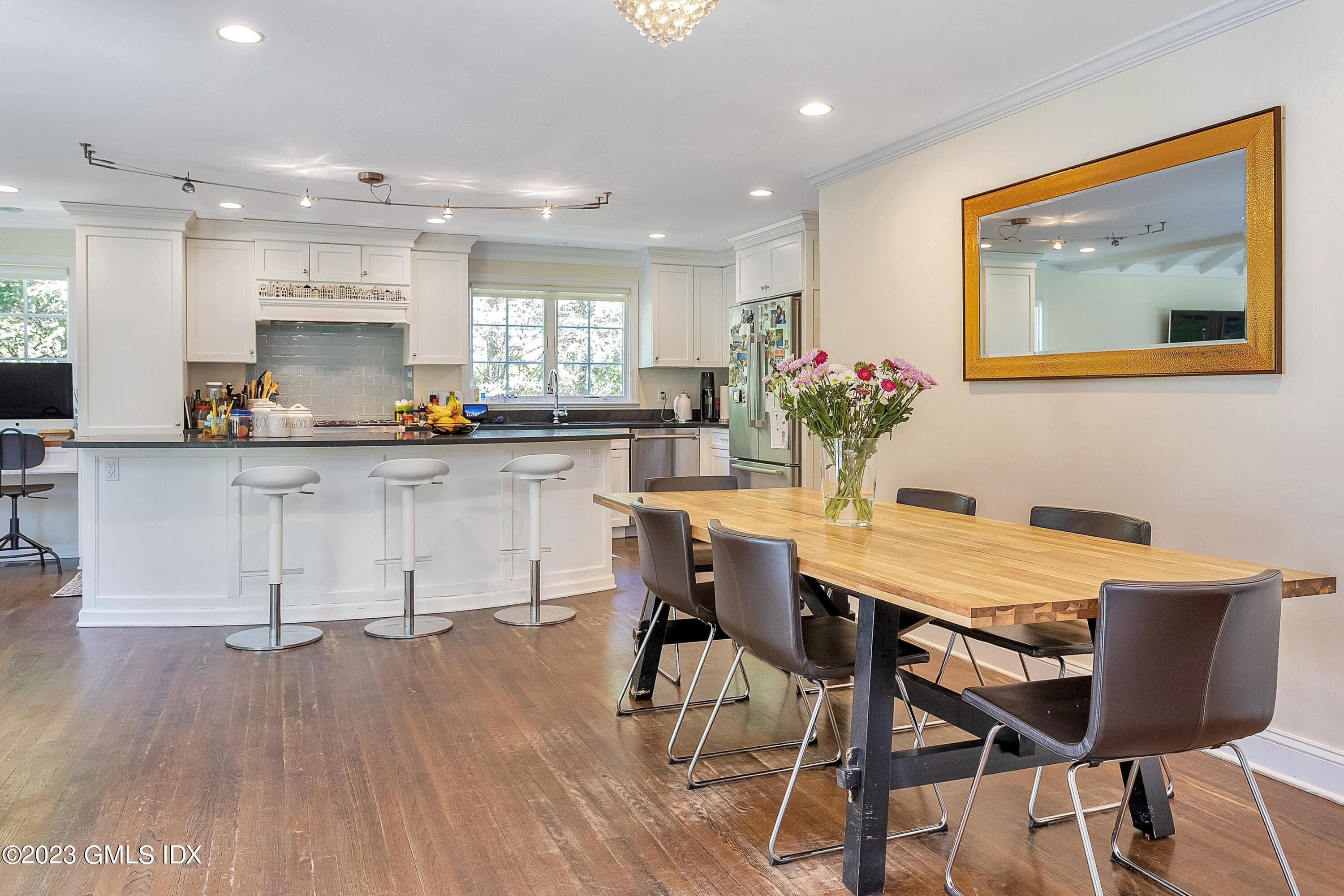 4 Bramble Lane Riverside, CT 06878 - Photo 7 of 19 a view of a dining room with furniture and wooden floor