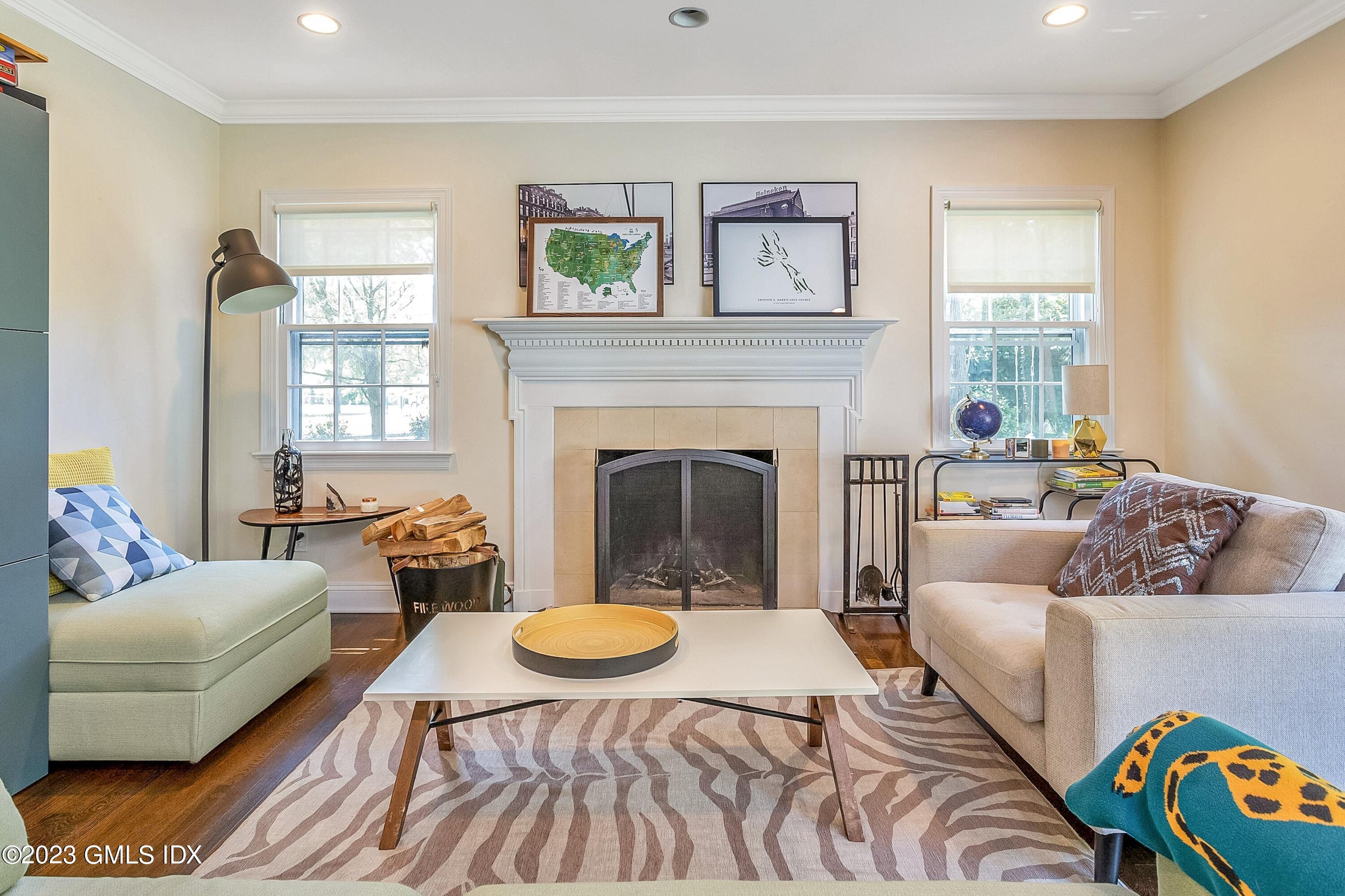 4 Bramble Lane Riverside, CT 06878 - Photo 10 of 19 a living room with furniture and a fireplace