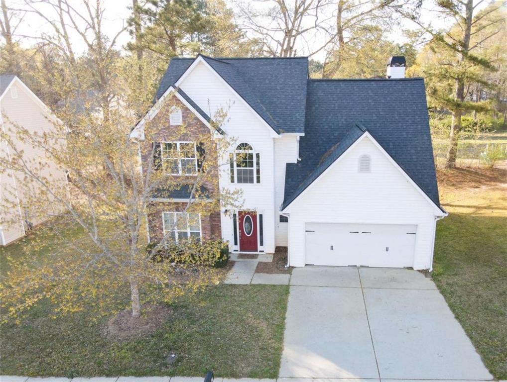 910 Lakeside Court Loganville, GA 30052 - Photo 4 of 57 a view of a house with a yard