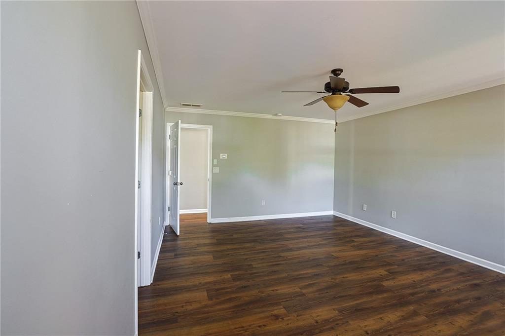 910 Lakeside Court Loganville, GA 30052 - Photo 43 of 57 a view of an empty room with wooden floor