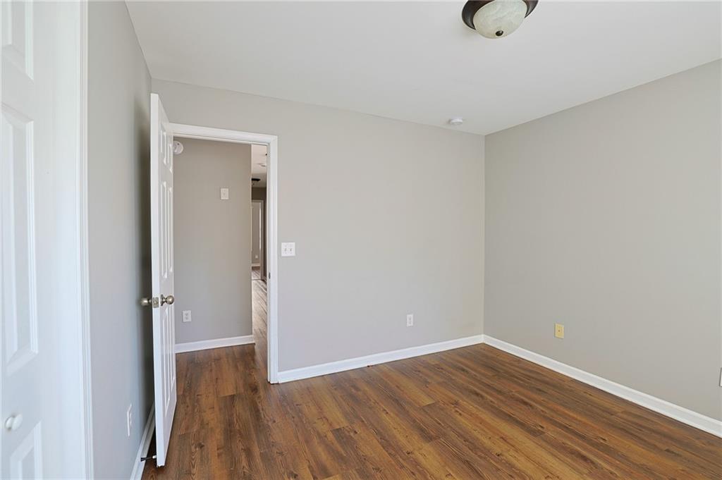 910 Lakeside Court Loganville, GA 30052 - Photo 55 of 57 a view of a room with wooden floor and a sink