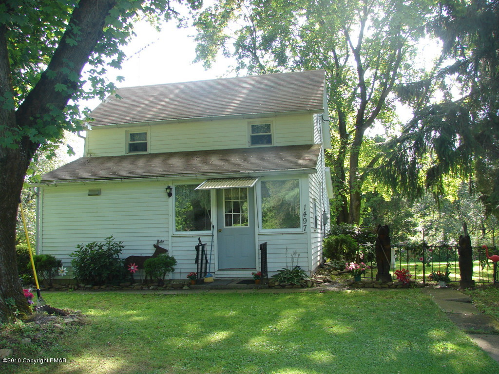 1497 Clearfield Road Nazareth, PA 18064 - Photo 1 of 13 a view of a house with a yard