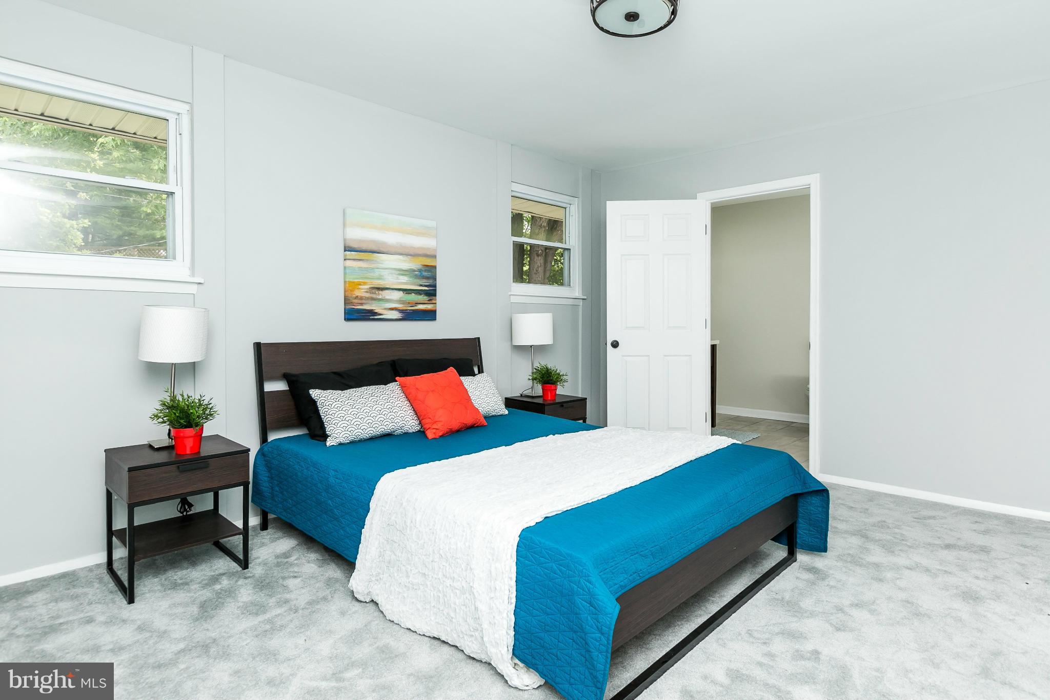 4527 Tapscott Road Baltimore, MD 21208 - Photo 20 of 30 a bedroom with a bed and a window