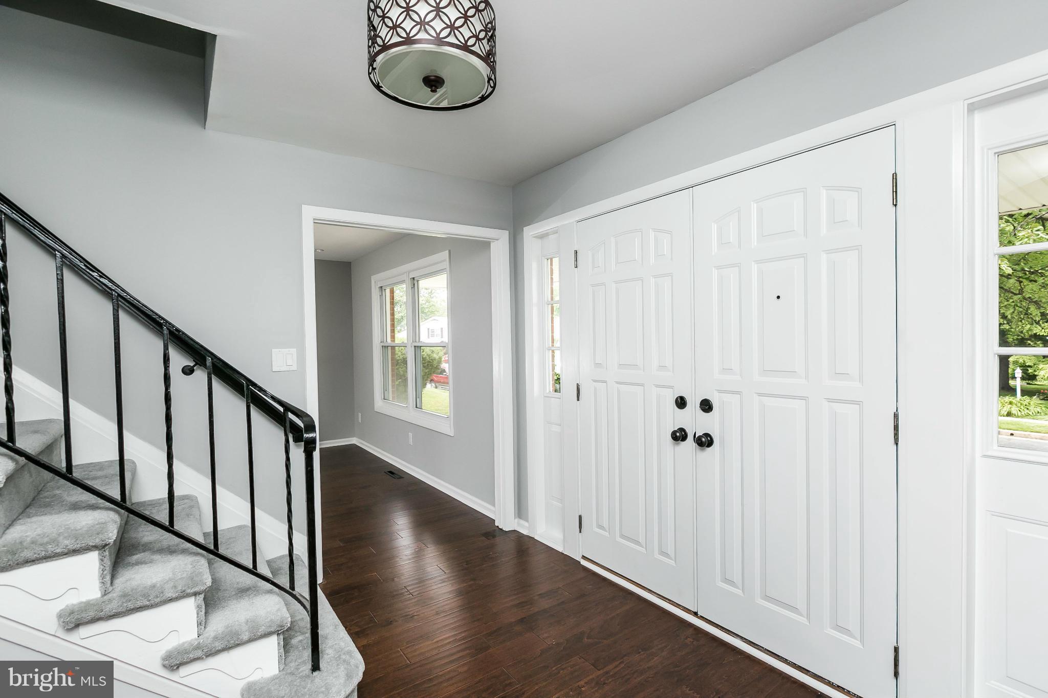 4527 Tapscott Road Baltimore, MD 21208 - Photo 3 of 30 a view of a hallway with wooden floor