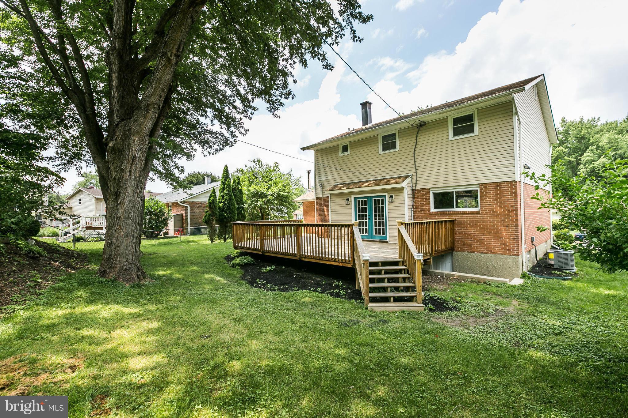 4527 Tapscott Road Baltimore, MD 21208 - Photo 26 of 30 a view of a house with a backyard and a slide